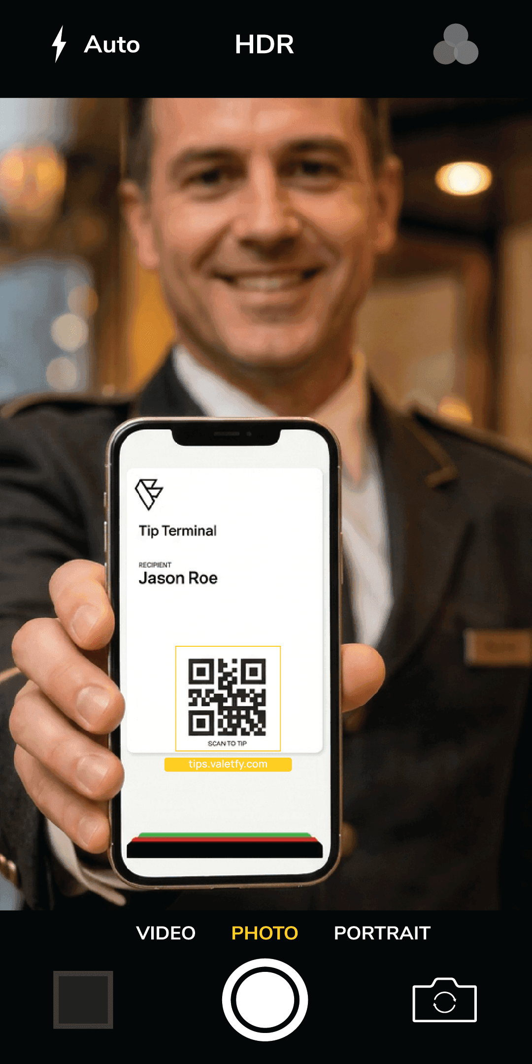 Operator showing a Valetfy Tip Terminal QR code to a guest
